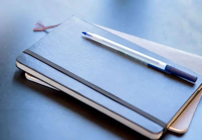 stack of notebooks and pens in Bozeman, MT