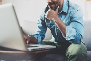 man looking at laptop