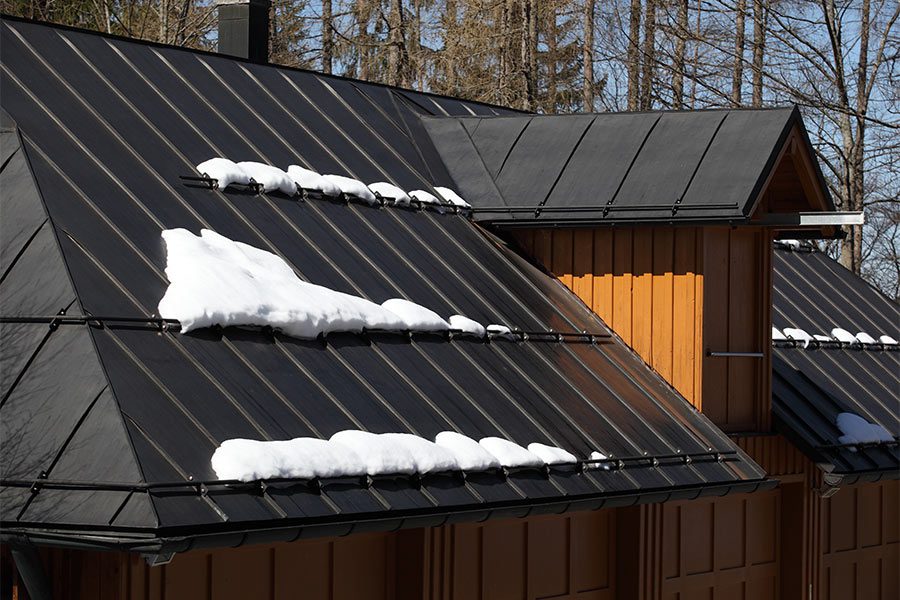 Metal roofing with snow