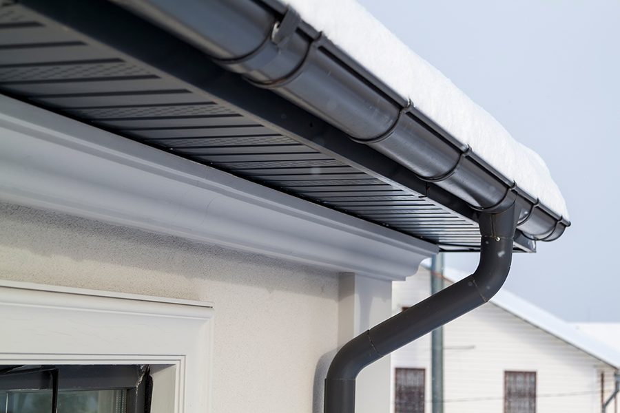 Metal roofing with snowy gutters